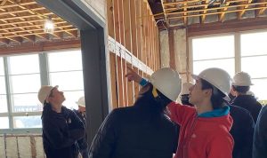 Students looking at construction framing