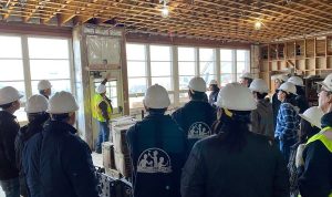 Students viewing College Hill construction site