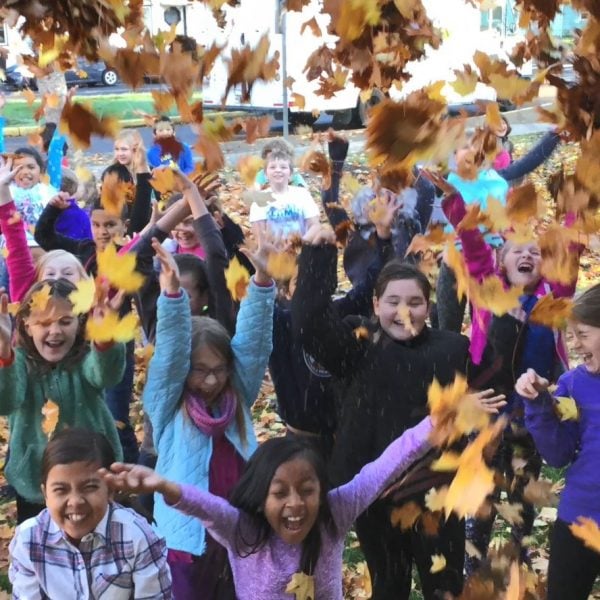 Lincoln students throwing leaves