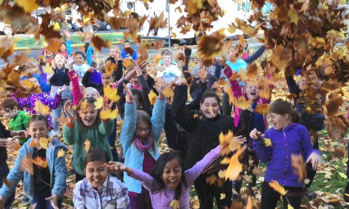 Lincoln students throwing leaves