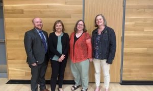 Newly elected school board members Judah Largent, Chris Hawkins, Terese Jones, and Sarah Finger McDonald.