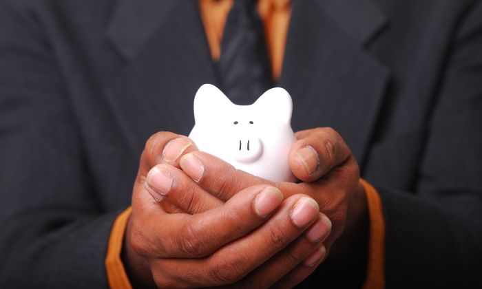 Man holding piggy bank