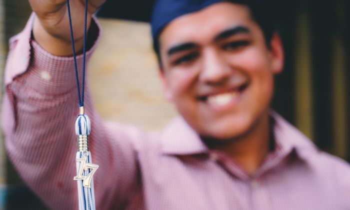 2017 graduation tassel held by a graduate